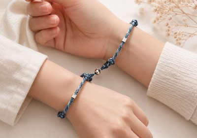 Matching bracelets for long distance relationship couple showing emotional connection